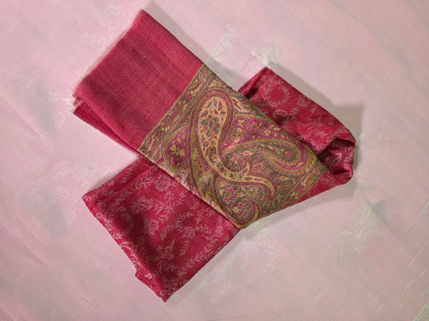 Cashmere shawl with intricate red pink yellow design, folded over