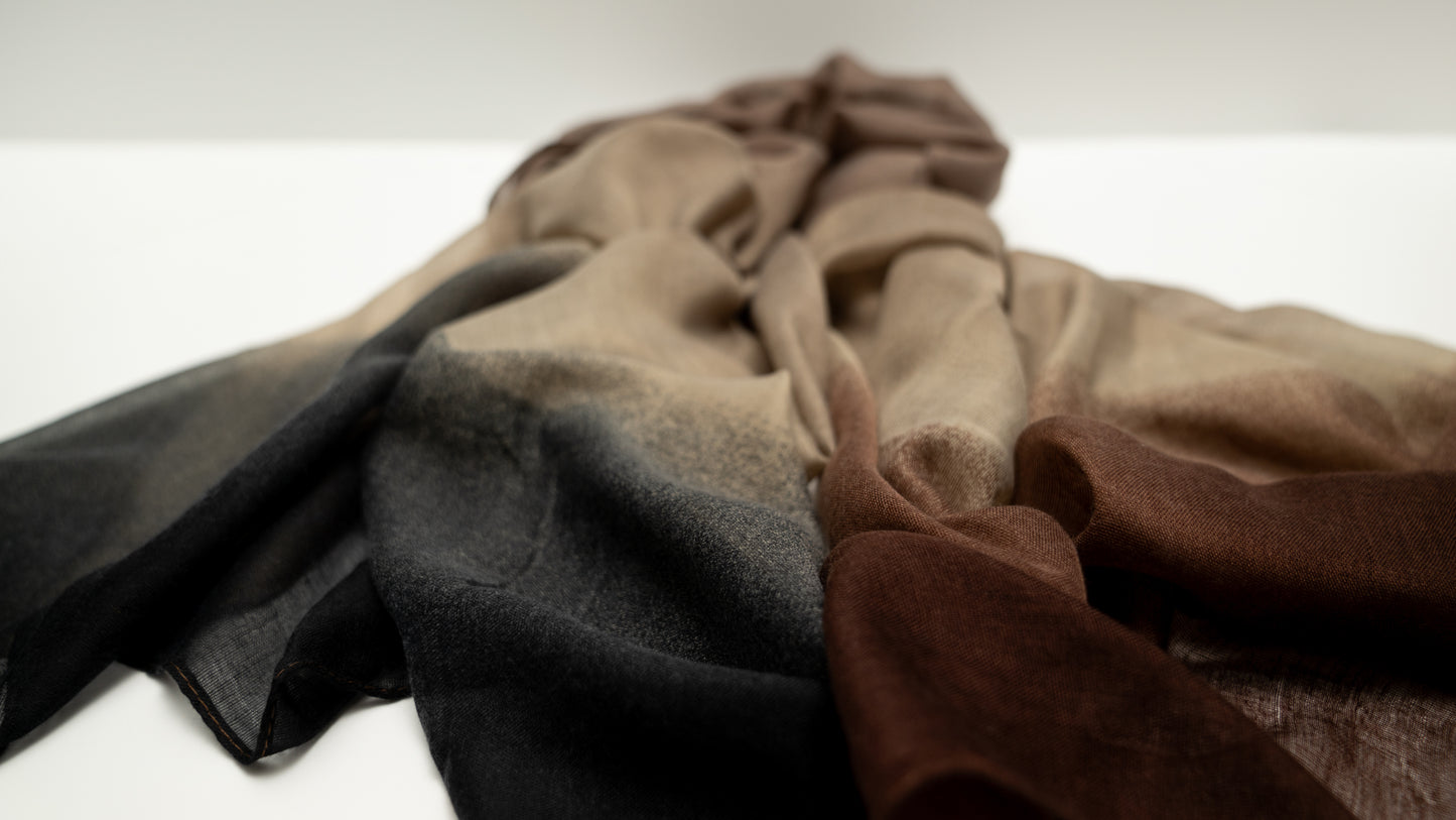 close-up of wool silk shawl with earthly tones of light and dark brown and black