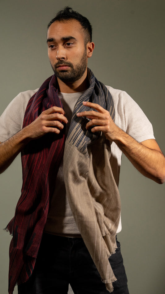 model wearing Wool silk scarf with light brown, dark navy black, and red.