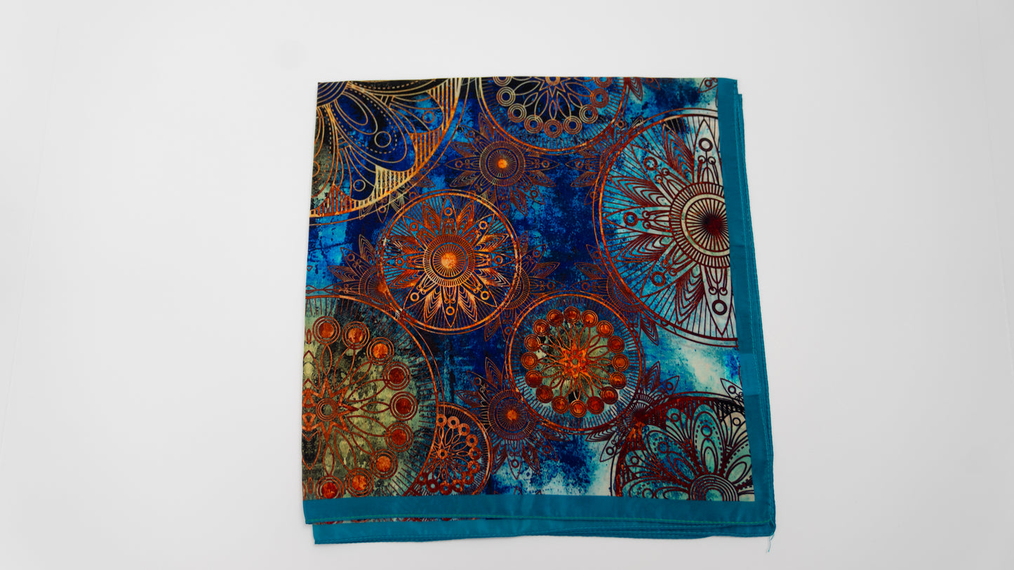 Vegan silk square bandana with intricate psychedelic patterns, folded.