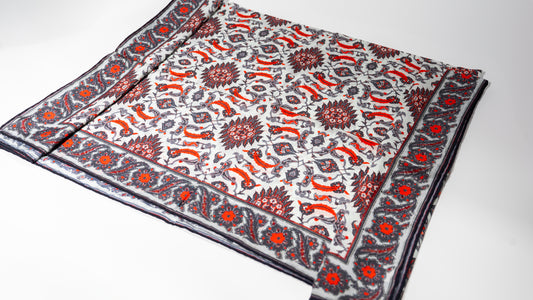 vegan silk scarf with white, grey, and  red tones. folded