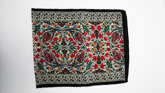 Long vegan silk scarf with colorful floral turkish designs, folded.