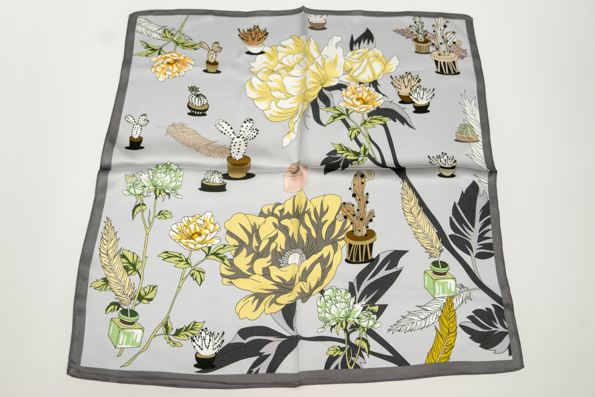 square silk scarf, 100% pure silk, floral design, predominantly light grey and yellow tones.