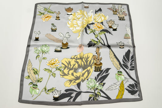 square silk scarf, 100% pure silk, floral design, predominantly light grey and yellow tones.
