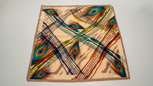 a beautiful square vegan silk bandana featuring peacock design with a light brown background