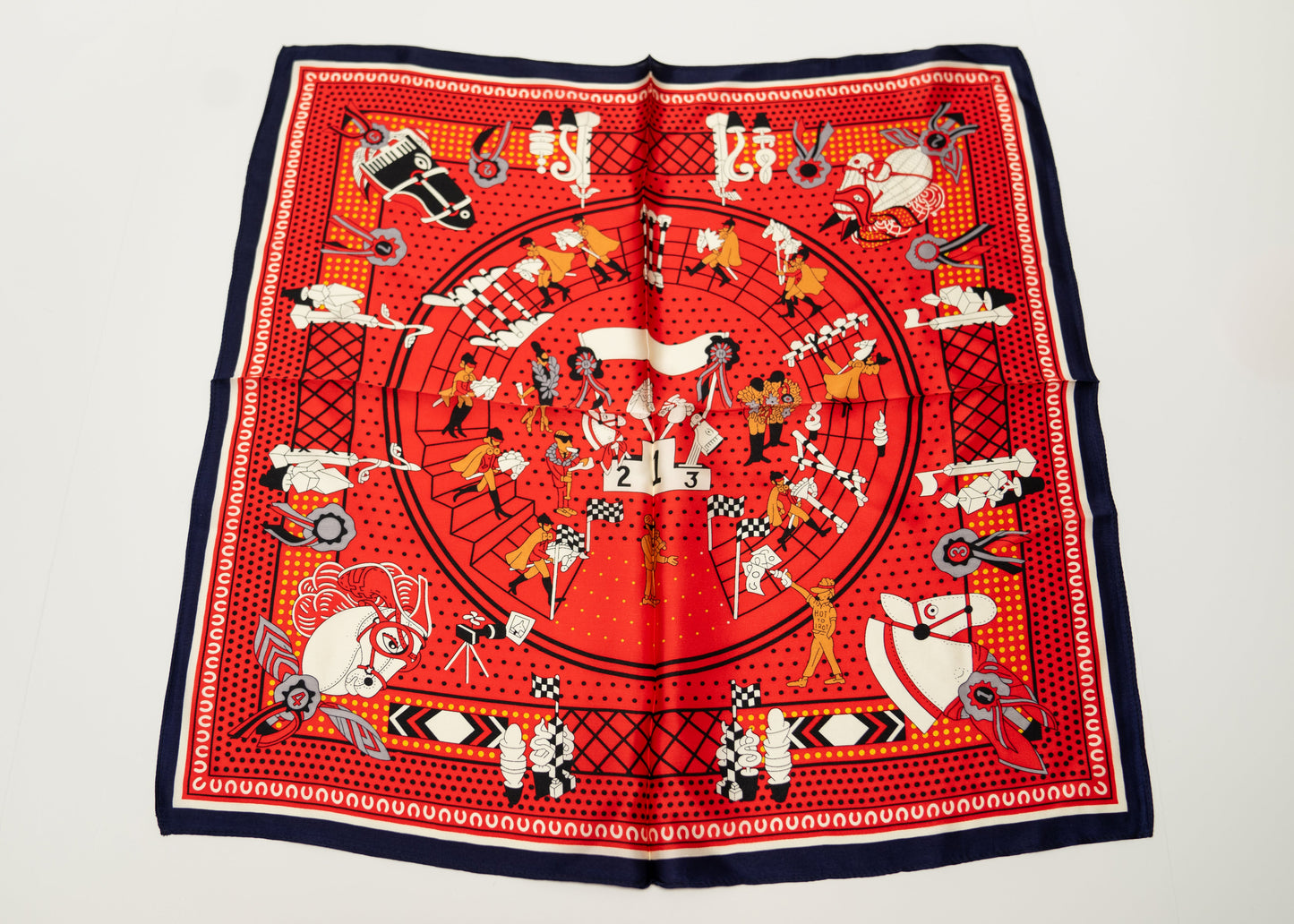 square silk scarf, 100% pure silk, design with humans and race horses, predominantly red and white tones.