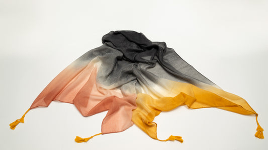 wool silk shawl with light pink/orange, yellow, white, and black. front