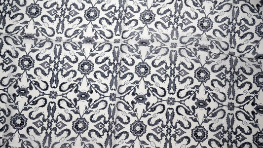 vegan silk scarf with white and black tones with intricate designs. close-up