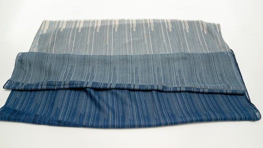 wool silk shawl with dark and light blue and lighter tones. folded front