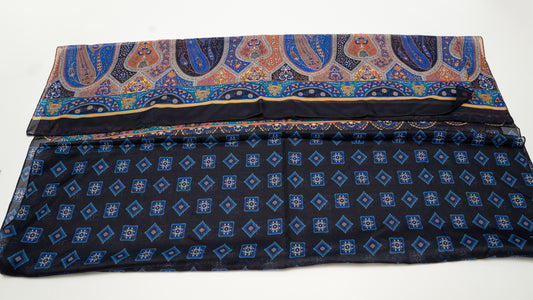 colourful cotton voile shawl with intricate designs and geometric figures, featuring black, blue, and orange tones. back-side.