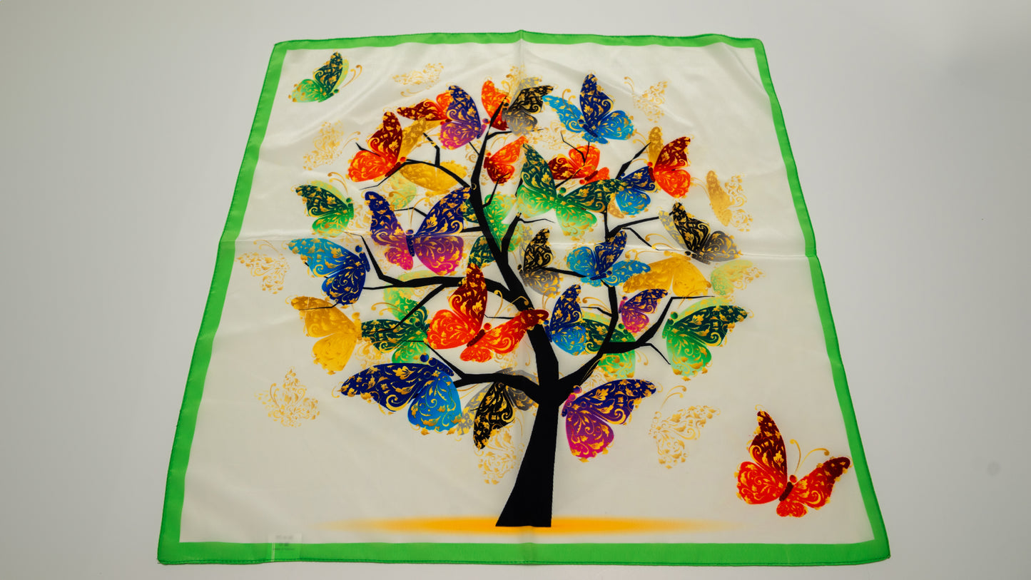 a colourful vegan silk bandana featuring a tree of colorful butterflies, outlined in bright green