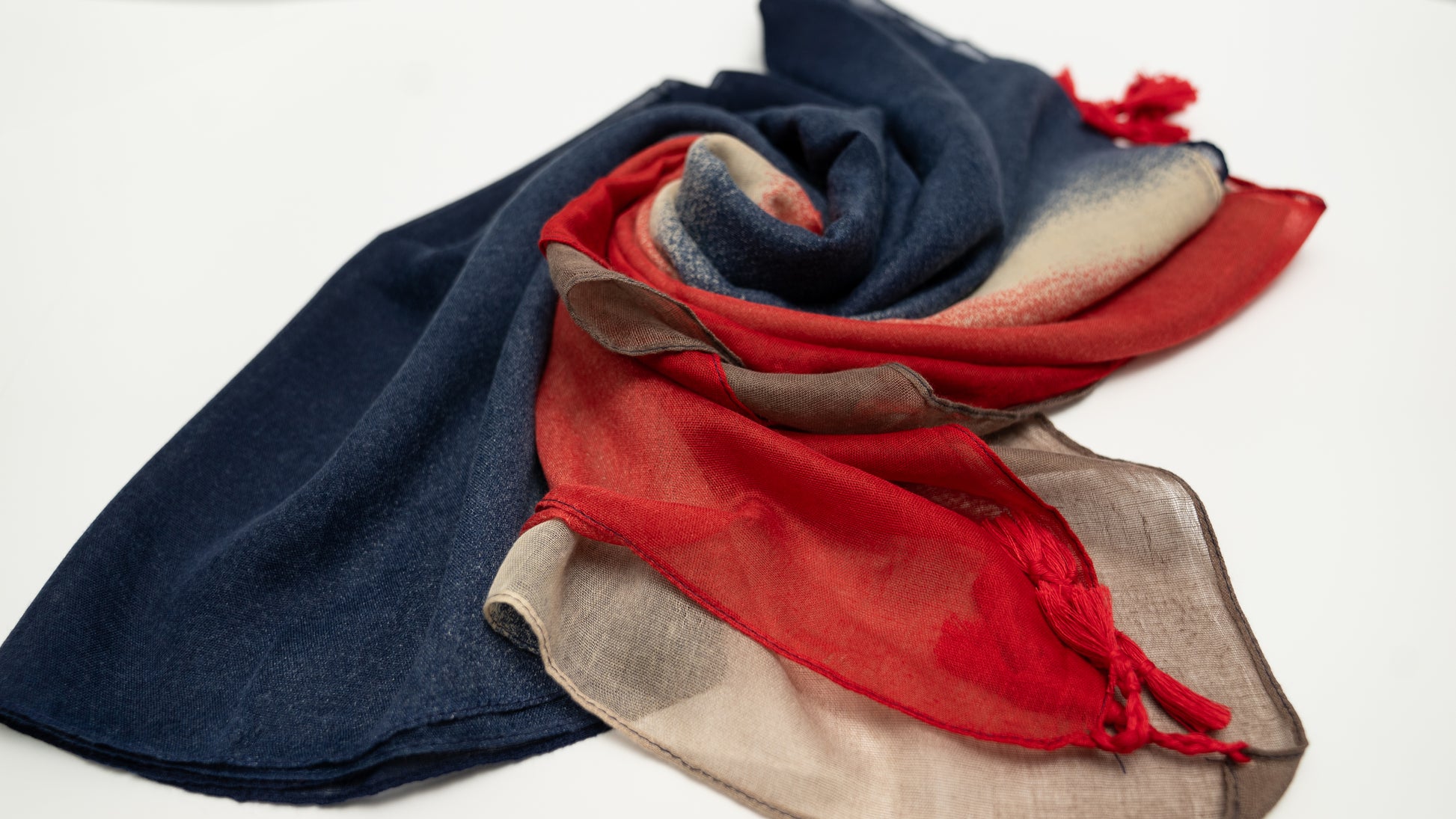 wool silk shawl with blue, light sand brown, and red. wrapped.