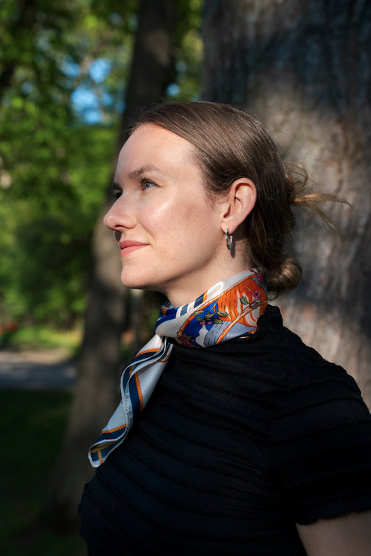 female model wearing a 100% pure silk handwoven square scarf, Balance.