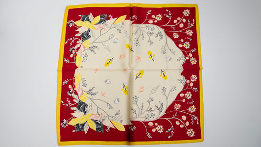 handwoven pure silk scarf with red, beige, and yellow tones.