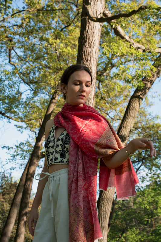 female blonde model wearing a pink cashmere shawl