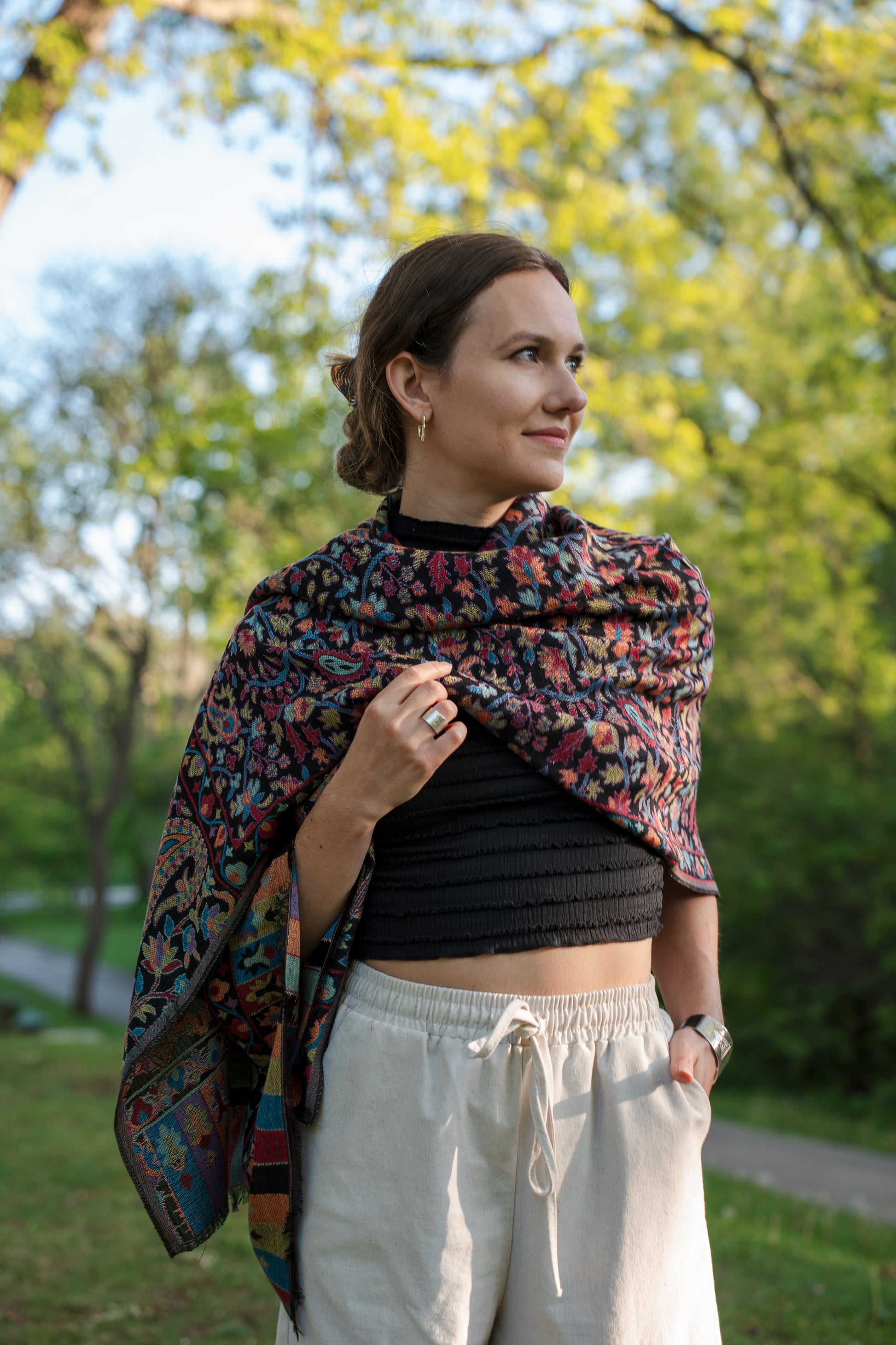 female model wearing a colourful cotton and wool Turkish shawl, the rainbow.