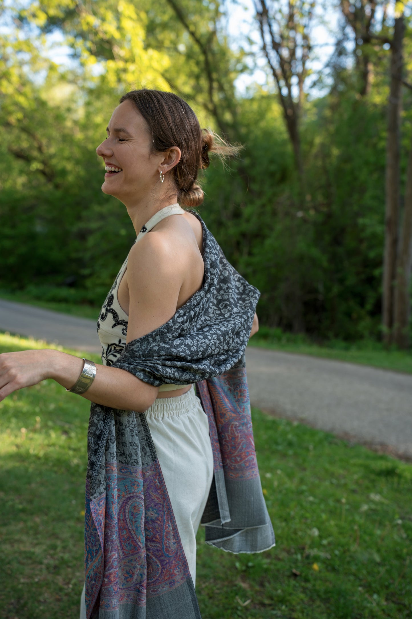 female model wearing black, white, and purple cashmere shawl