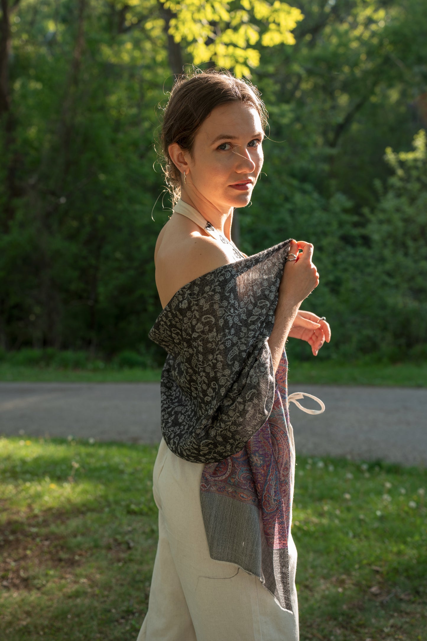 female model wearing black, white, and purple cashmere shawl