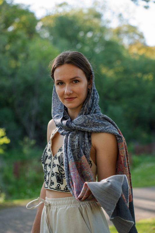 female model wearing a blue cashmere shawl